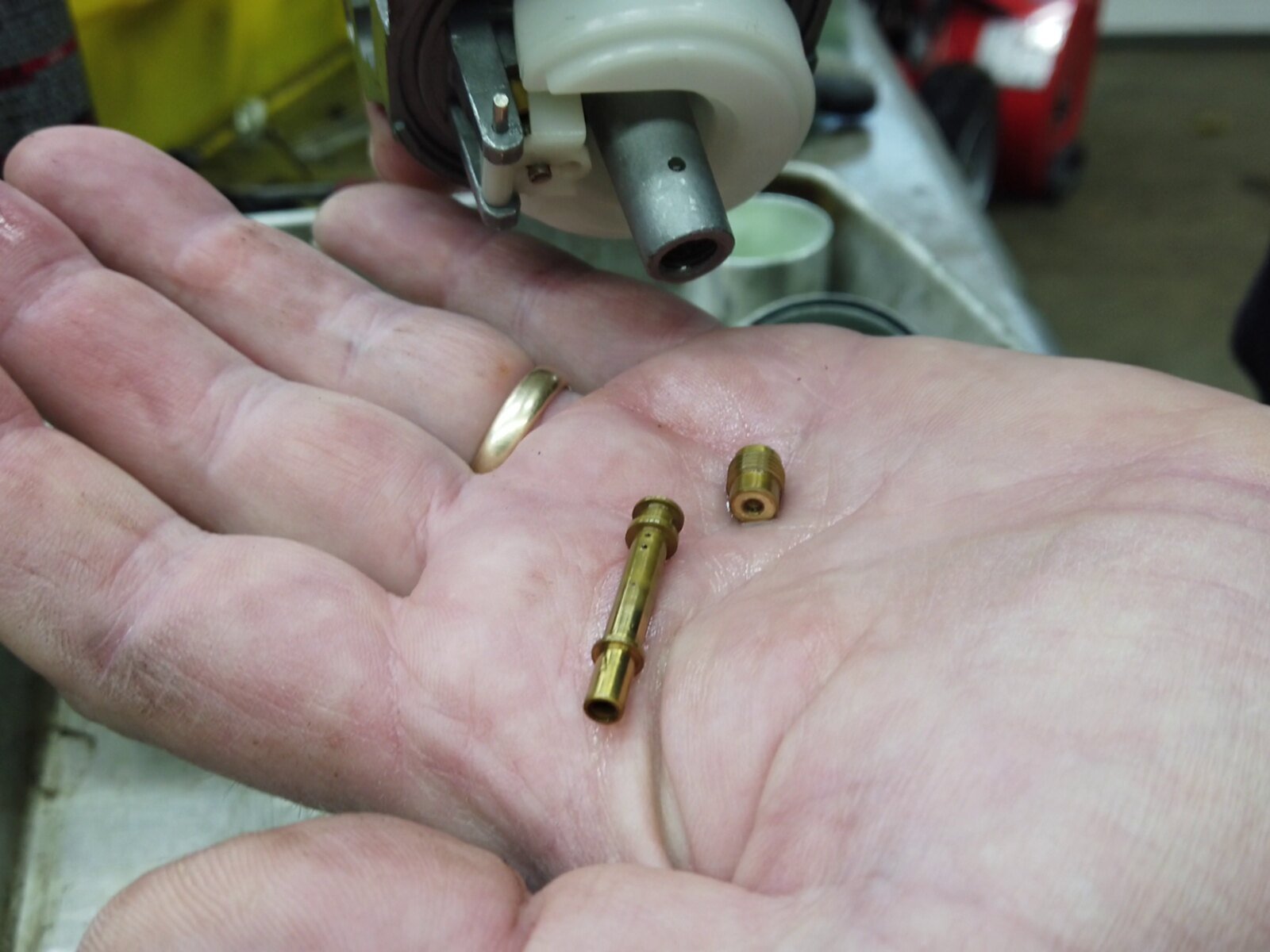 Main jet and emulsion tube from a Briggs 420cc engine carburetor